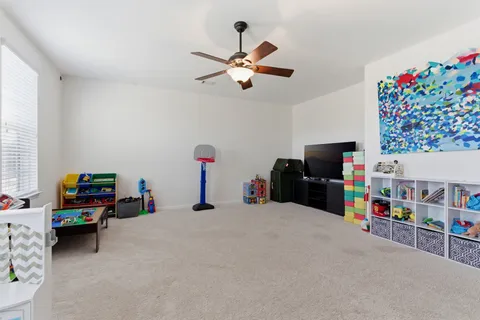 a view of a livingroom with furniture and a flat screen tv