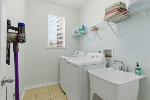 a view of a house with a yard and deck