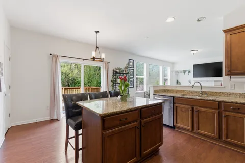 a kitchen with a stove a sink and a refrigerator