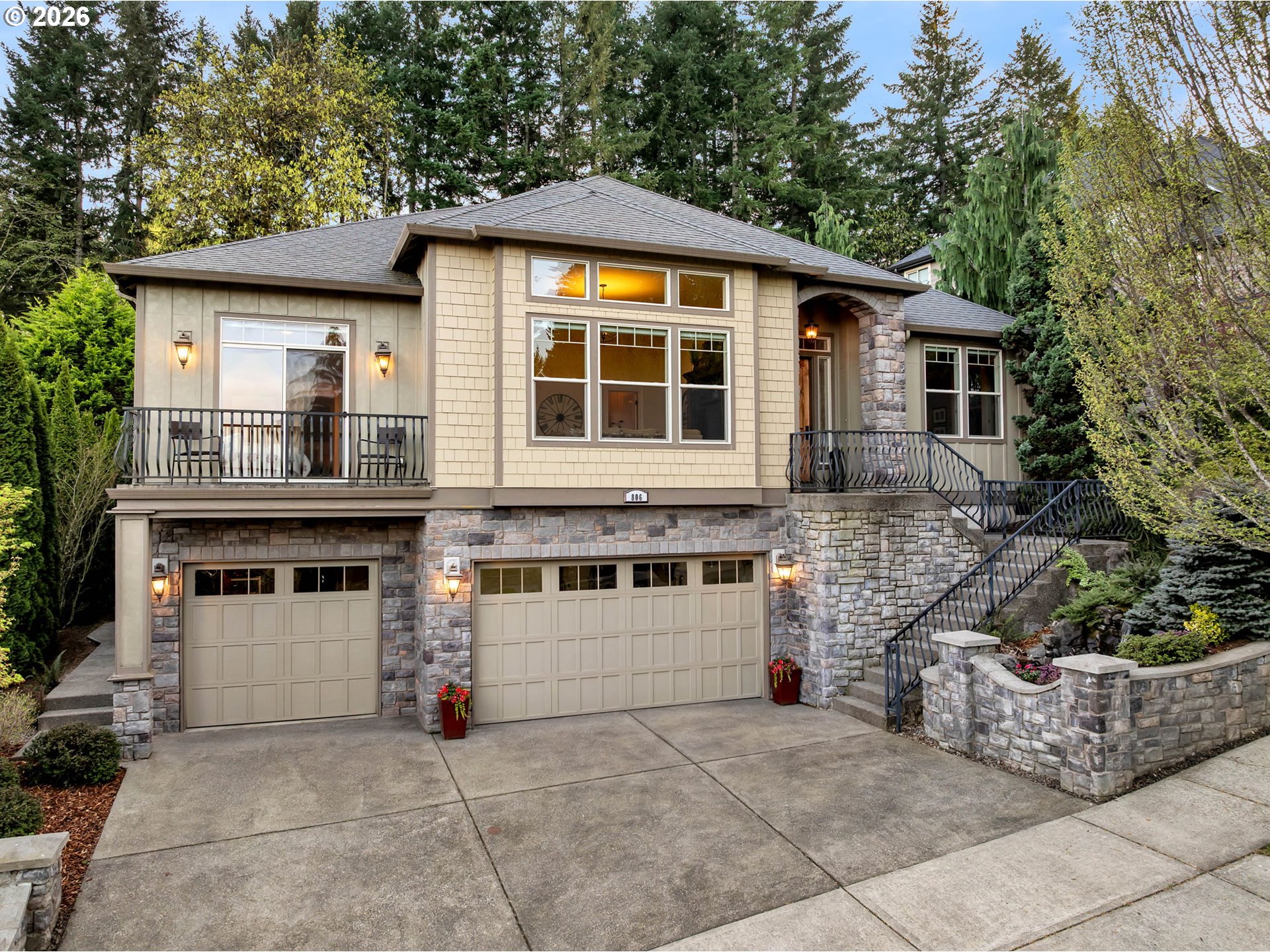 a front view of a house with a garden