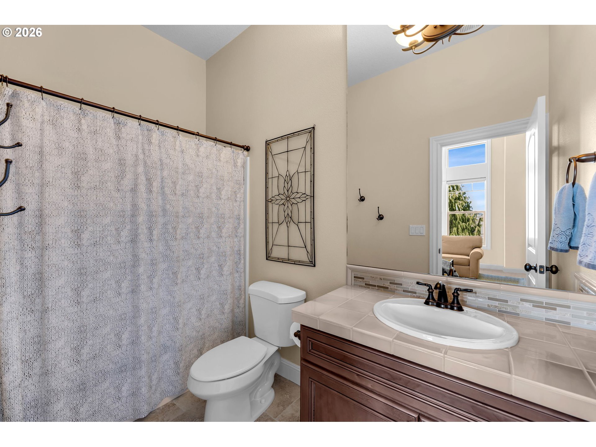 806 Northwest 35th Avenue Camas, WA 98607 - Photo 32 of 48 a bathroom with a sink toilet a mirror and shower curtain
