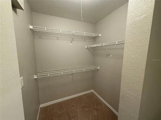 a view of a room with racks on the wall