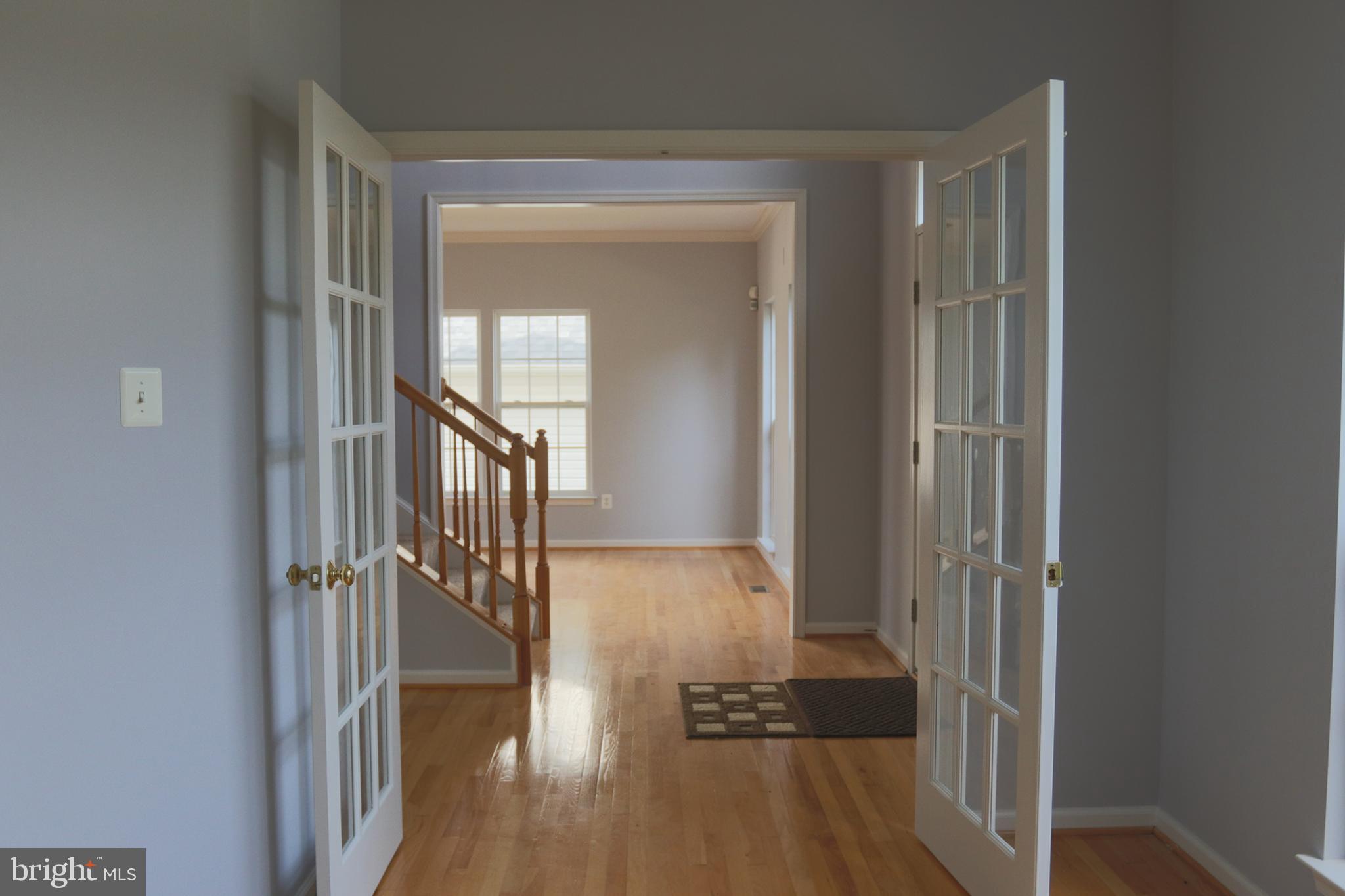 14404 Autumn Crest Road Boyds, MD 20841 - Photo 17 of 103 a view of hallway with stairs and wooden floor