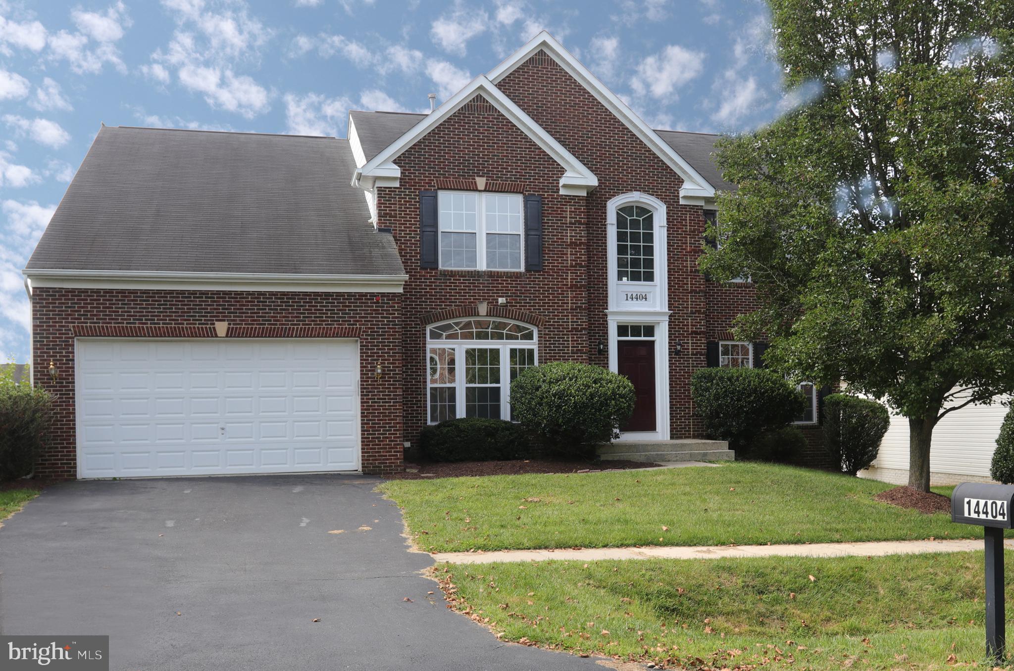 14404 Autumn Crest Road Boyds, MD 20841 - Photo 3 of 103 a front view of a house with a garden and plants