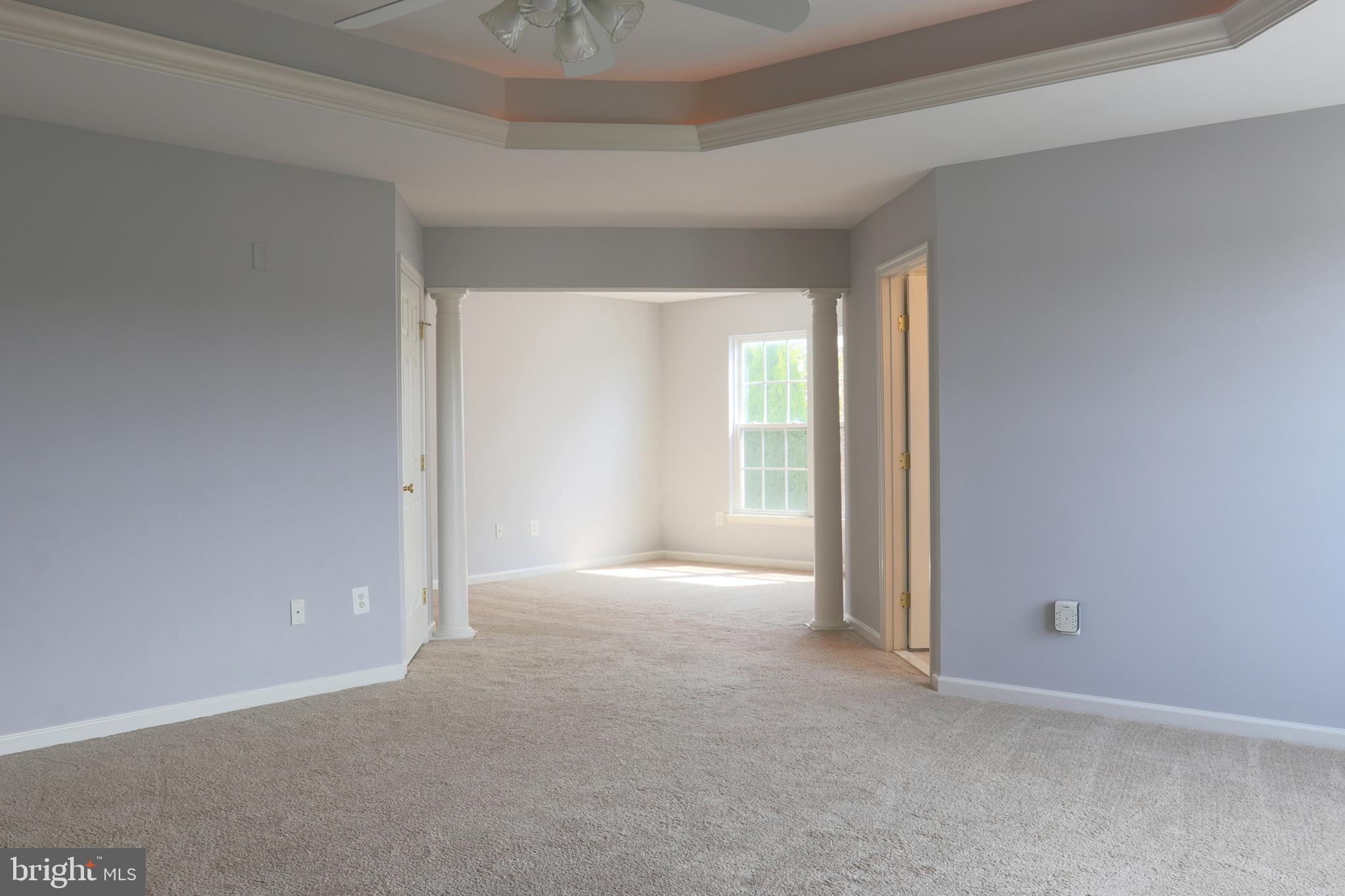 14404 Autumn Crest Road Boyds, MD 20841 - Photo 35 of 103 an empty room with windows and chandelier fan