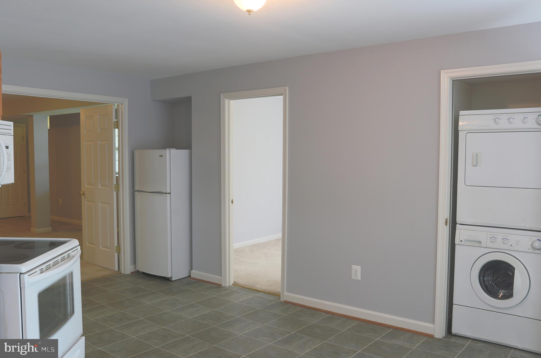 14404 Autumn Crest Road Boyds, MD 20841 - Photo 70 of 103 a view of a storage & utility room with washer and dryer