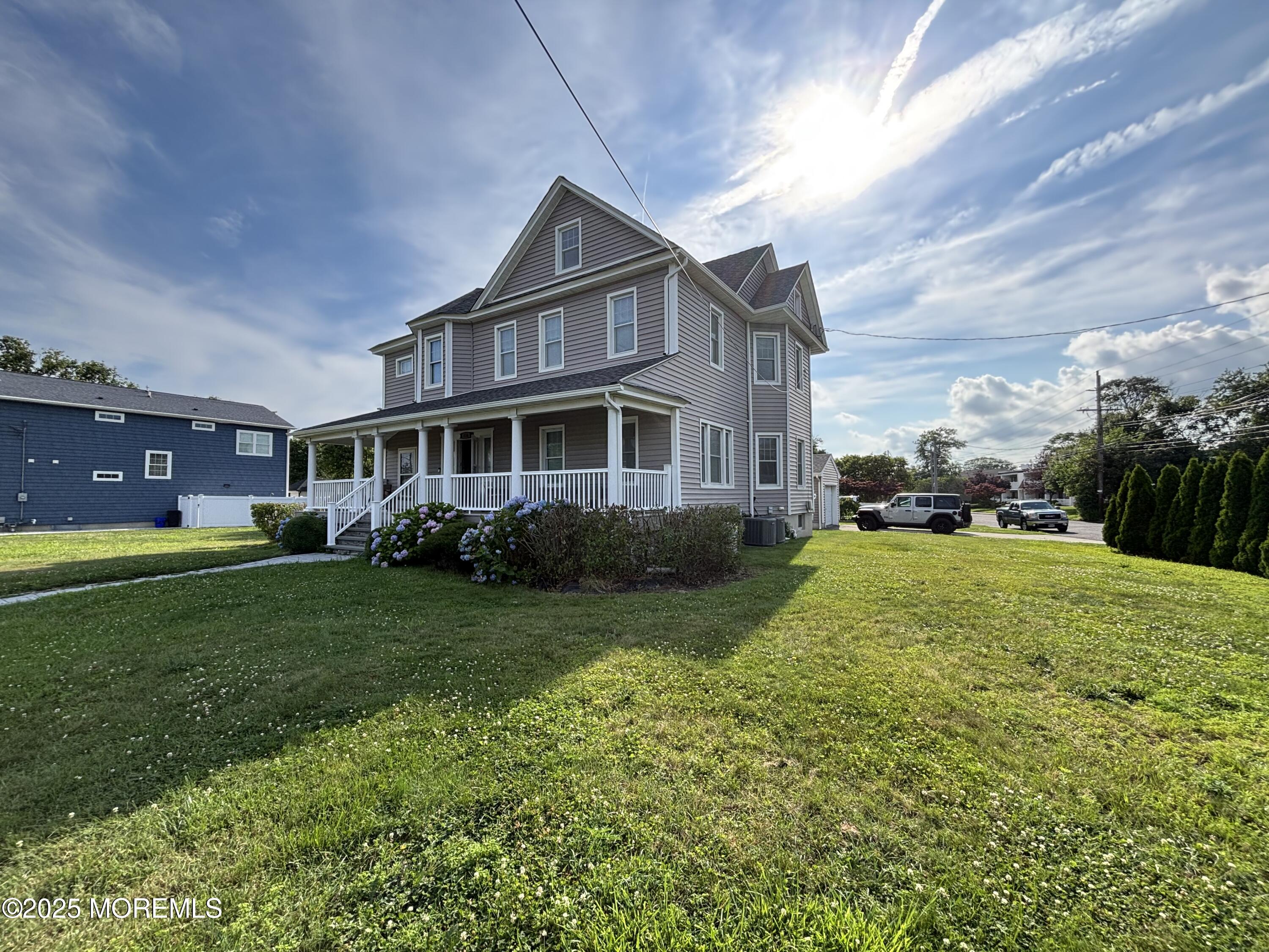 516 2nd Avenue Long Branch, NJ 07740 - Photo 15 of 52 a front view of a house with a yard