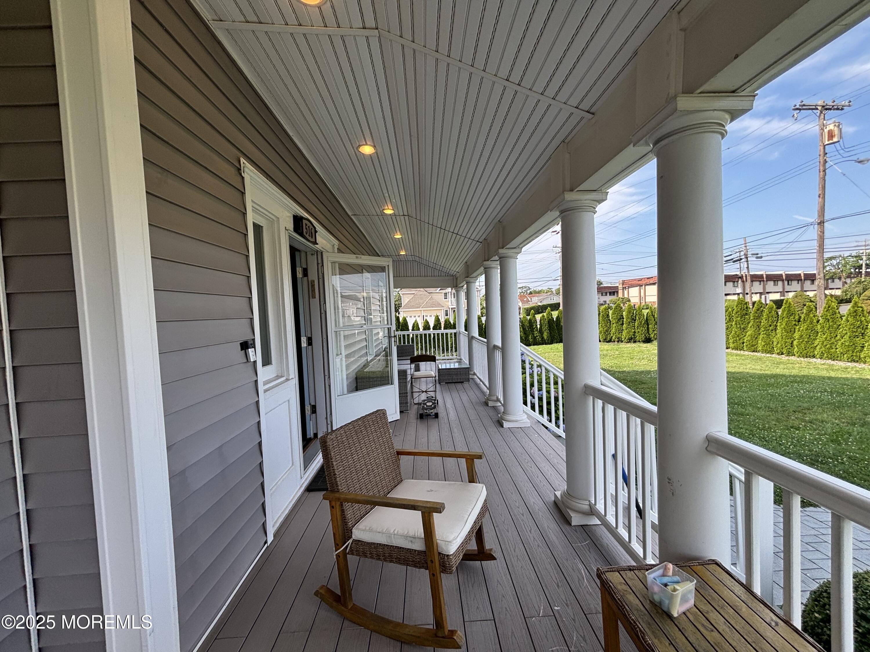 516 2nd Avenue Long Branch, NJ 07740 - Photo 16 of 52 a view of a porch with furniture and garden