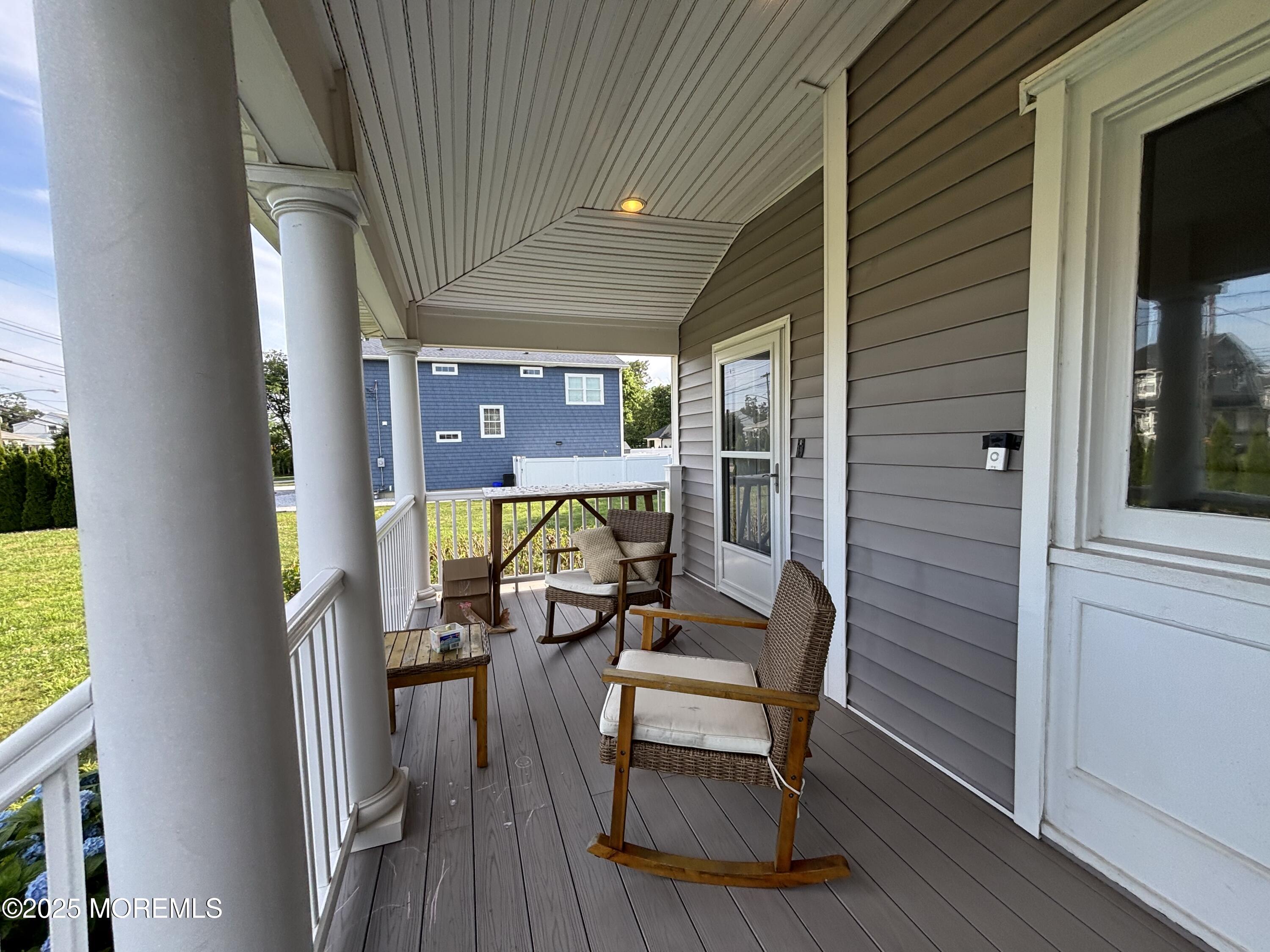 516 2nd Avenue Long Branch, NJ 07740 - Photo 18 of 52 a view of a porch with furniture