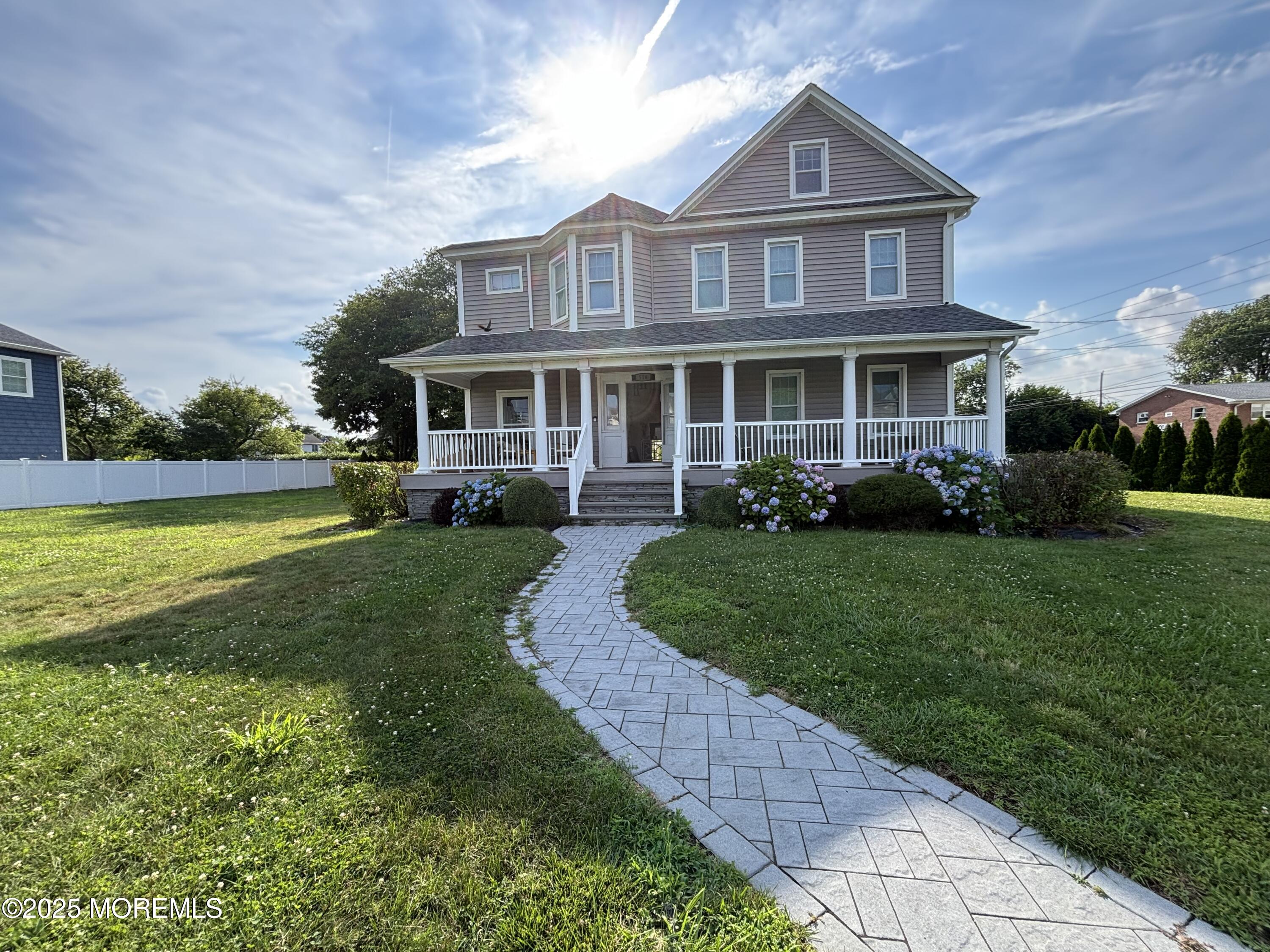 516 2nd Avenue Long Branch, NJ 07740 - Photo 2 of 52 a front view of a house with a yard