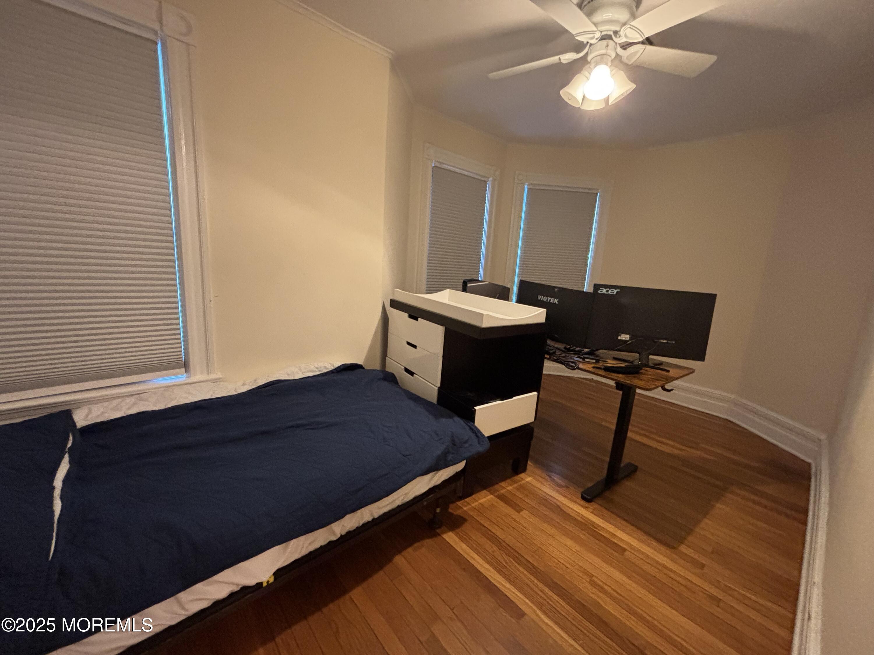 516 2nd Avenue Long Branch, NJ 07740 - Photo 32 of 52 a living room with a bed furniture and a window