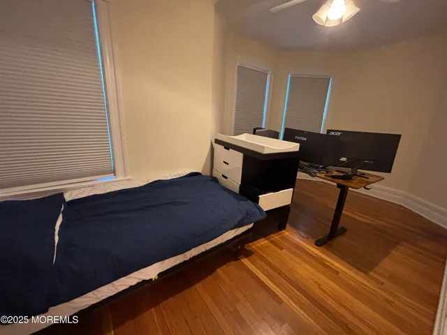 a bed room with bed and mirror