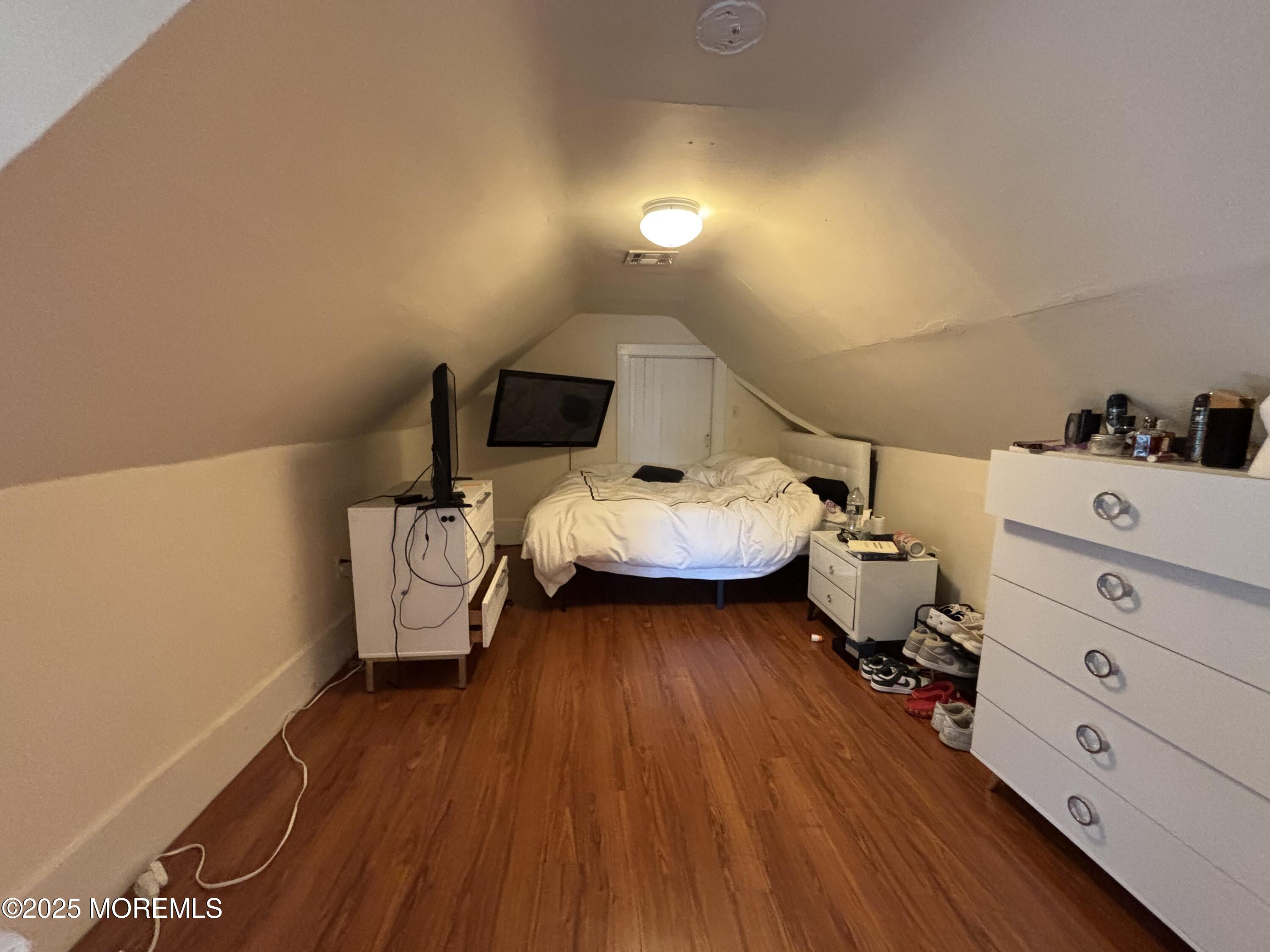 516 2nd Avenue Long Branch, NJ 07740 - Photo 36 of 52 a bed room with bed and mirror