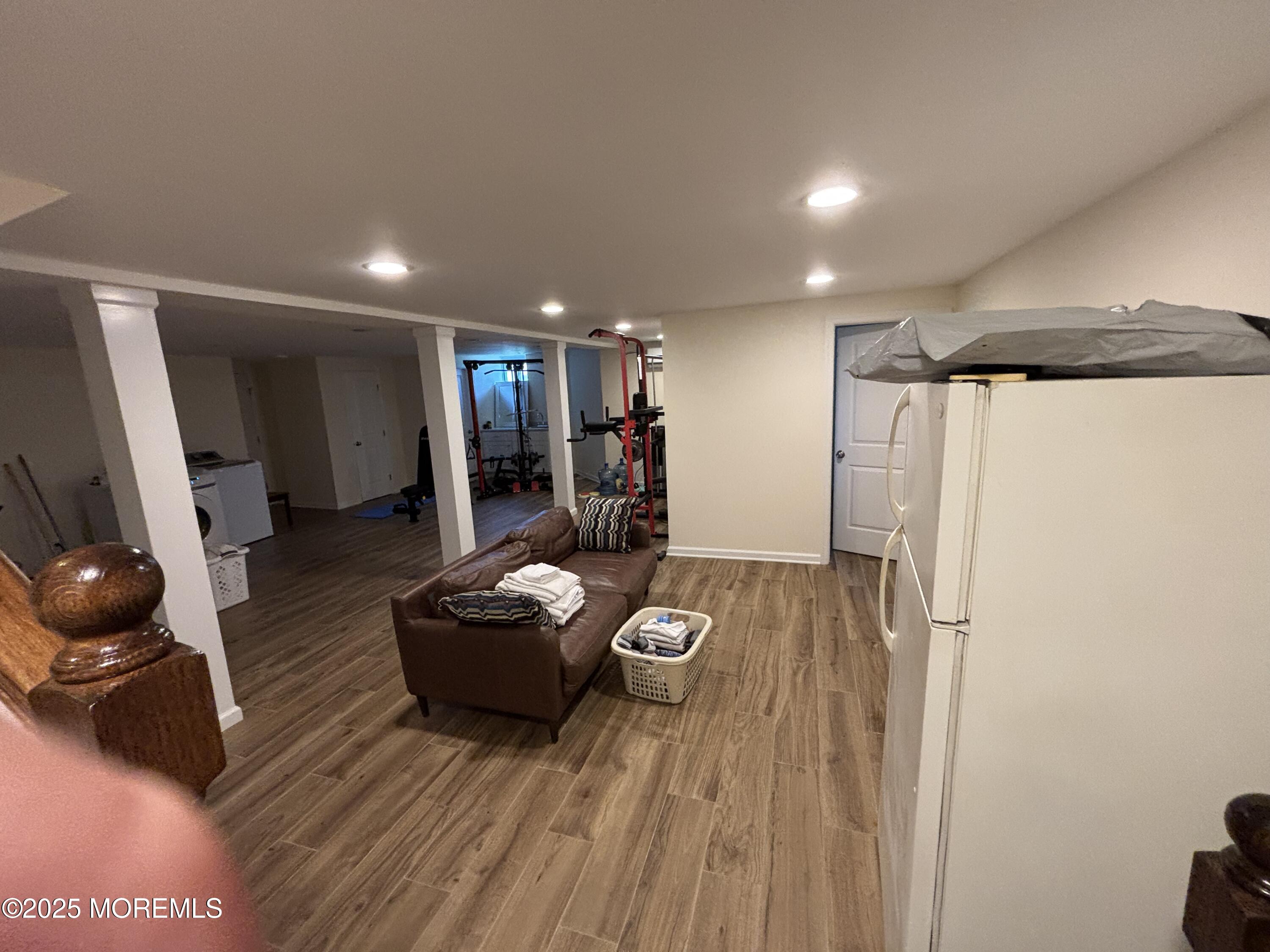 516 2nd Avenue Long Branch, NJ 07740 - Photo 37 of 52 a living room with furniture and a wooden floor
