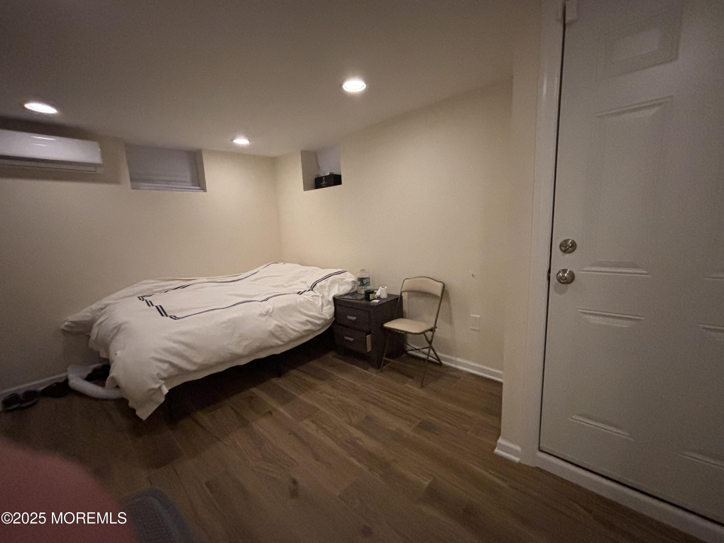 516 2nd Avenue Long Branch, NJ 07740 - Photo 39 of 52 a bedroom with a bed and a mirror