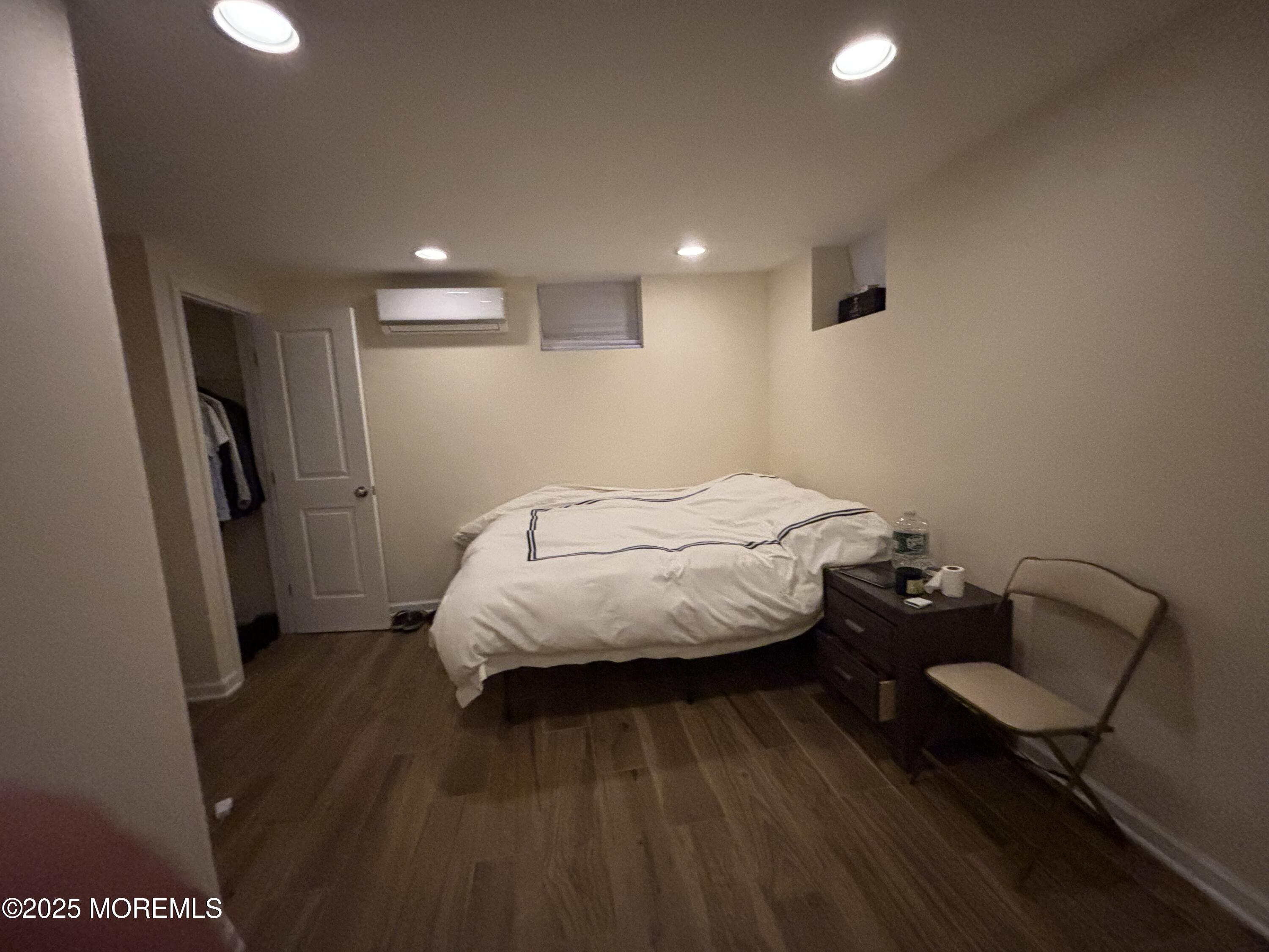 516 2nd Avenue Long Branch, NJ 07740 - Photo 42 of 52 a bed room with a bed and a chair