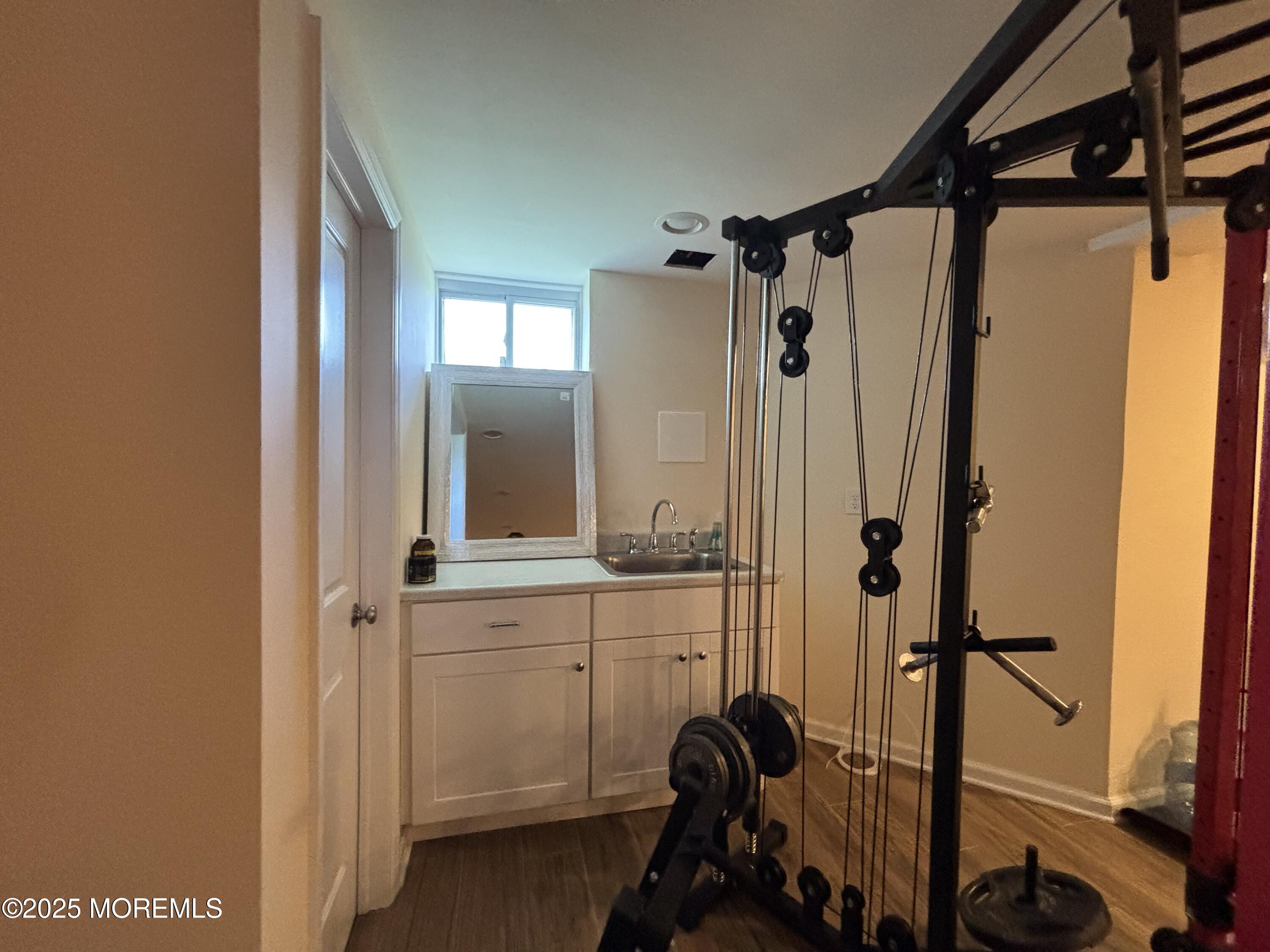 516 2nd Avenue Long Branch, NJ 07740 - Photo 43 of 52 a view of a bathroom with a sink and mirror