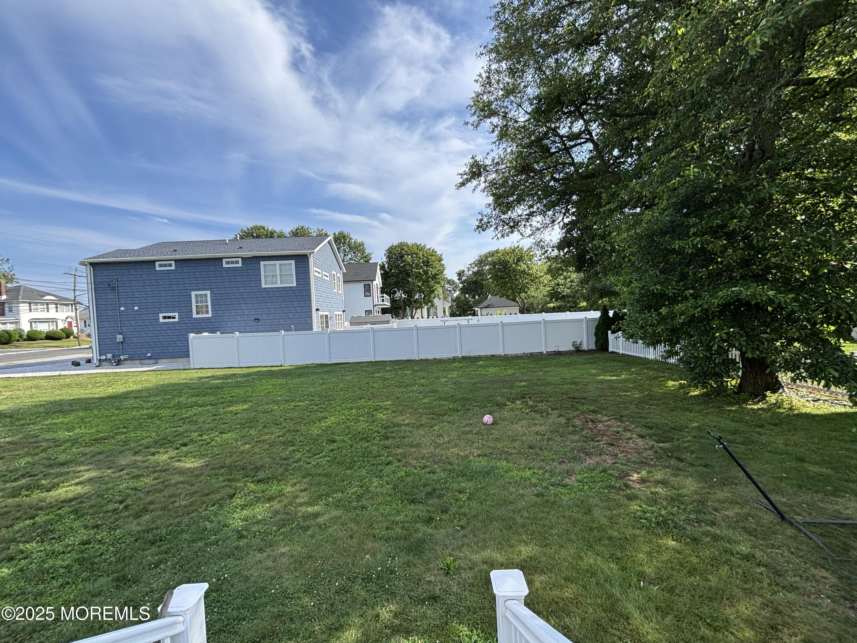 516 2nd Avenue Long Branch, NJ 07740 - Photo 50 of 52 a view of yard with grass and a large tree