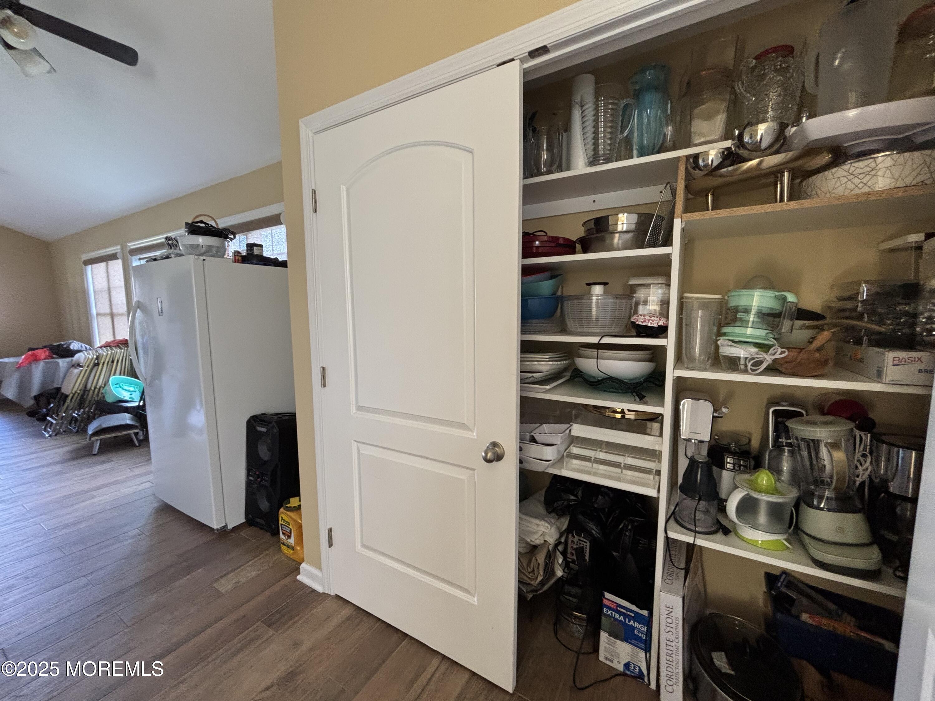 516 2nd Avenue Long Branch, NJ 07740 - Photo 9 of 52 a view of walk in closet with clothes and shoes
