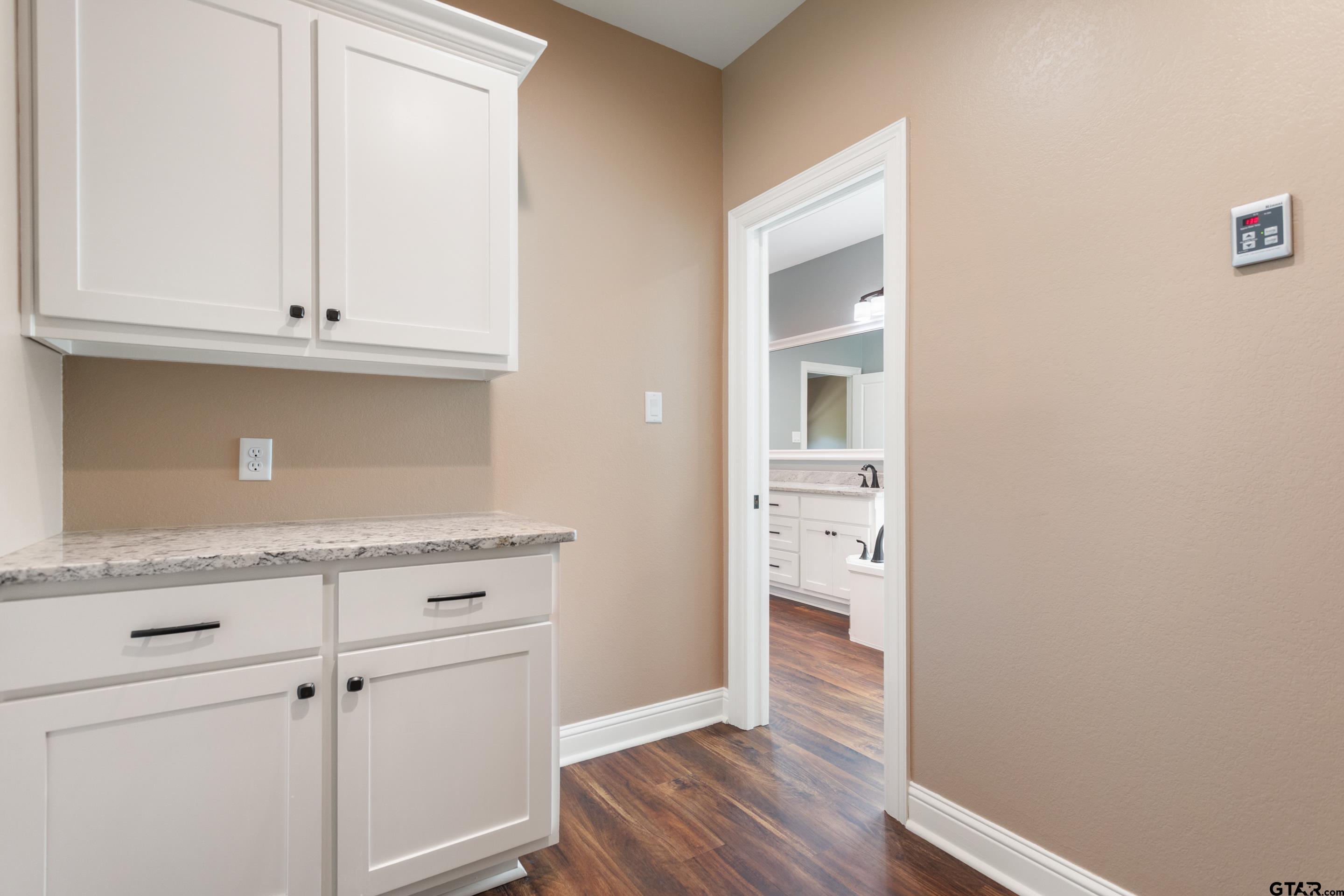 105 Nathan Road Chandler, TX 75758 - Photo 14 of 36 a view of a kitchen with wooden floor