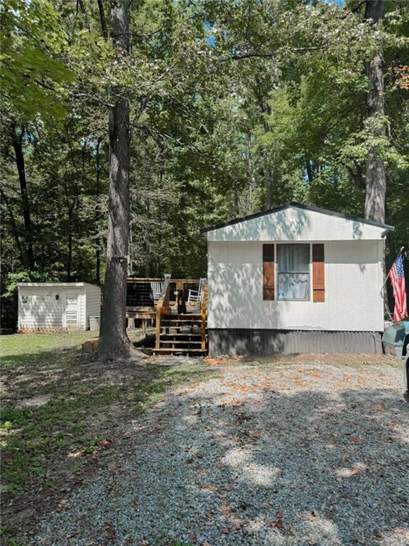 10 Lindsey Lane Northwest Rome, GA 30165 - Photo 1 of 16 a backyard of a house with table and chairs