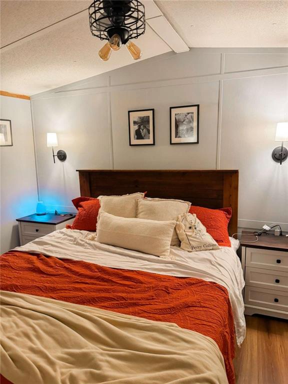 10 Lindsey Lane Northwest Rome, GA 30165 - Photo 13 of 16 a bedroom with a bed and a night stand