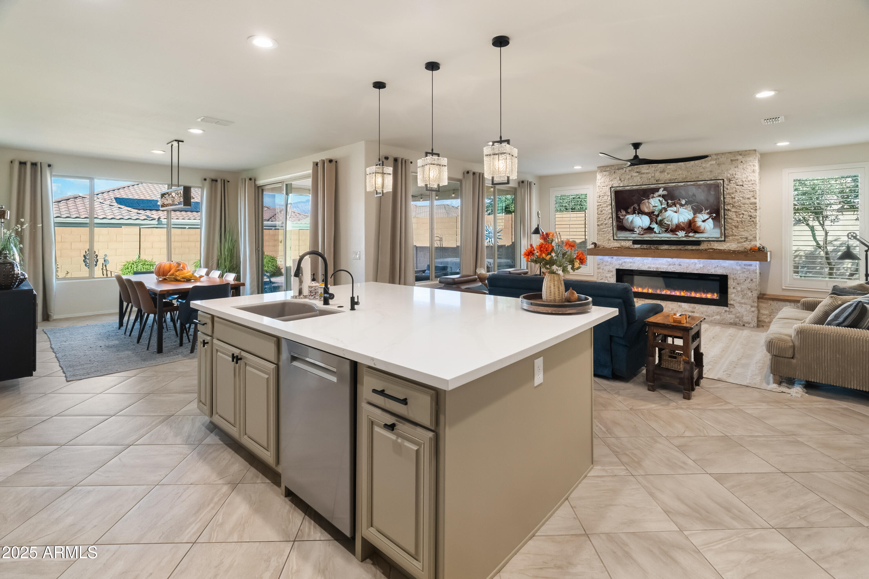 26990 West Utopia Road Buckeye, AZ 85396 - Photo 11 of 41 a kitchen that has a lot of cabinets in it
