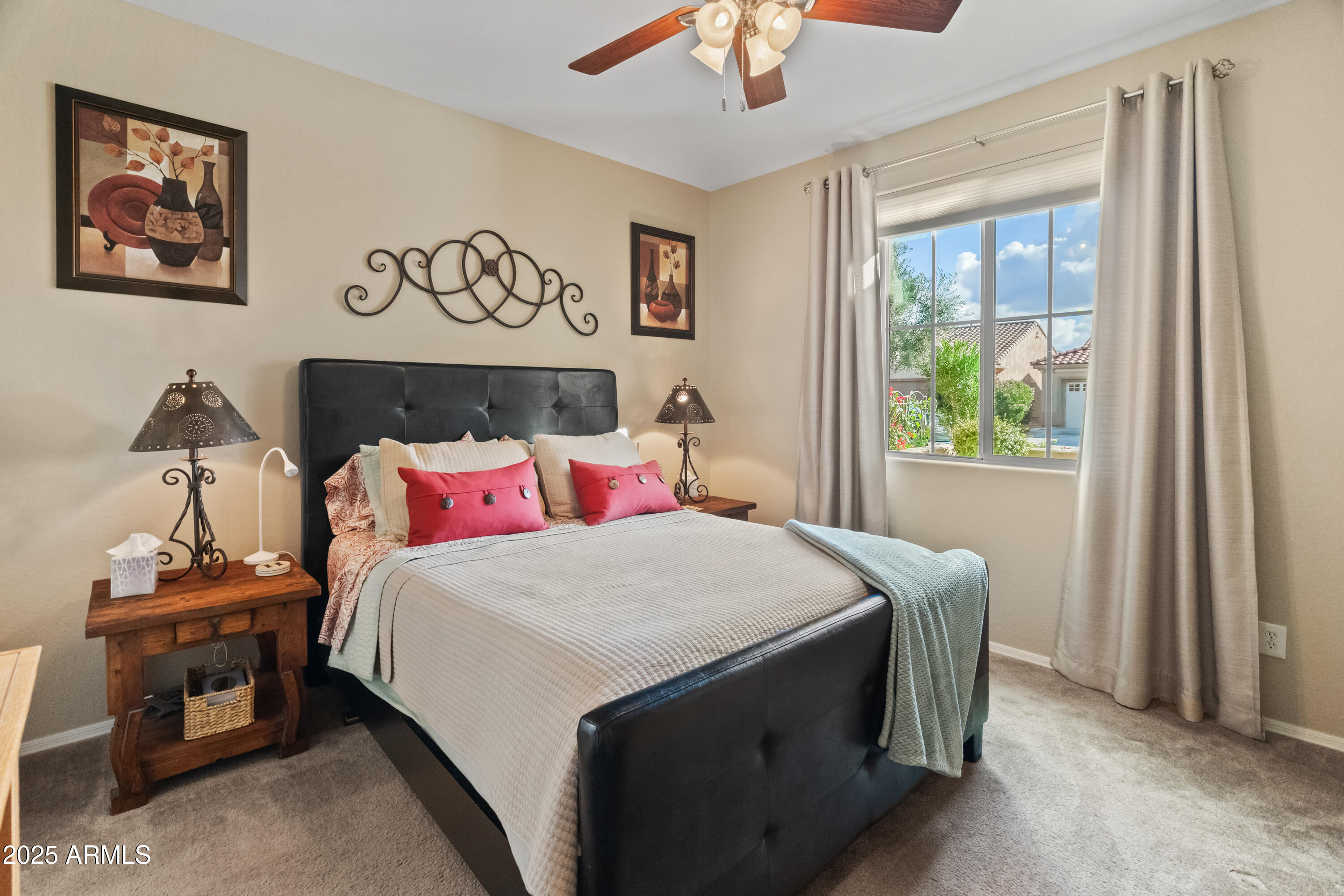 26990 West Utopia Road Buckeye, AZ 85396 - Photo 24 of 41 a bedroom with a bed and a window