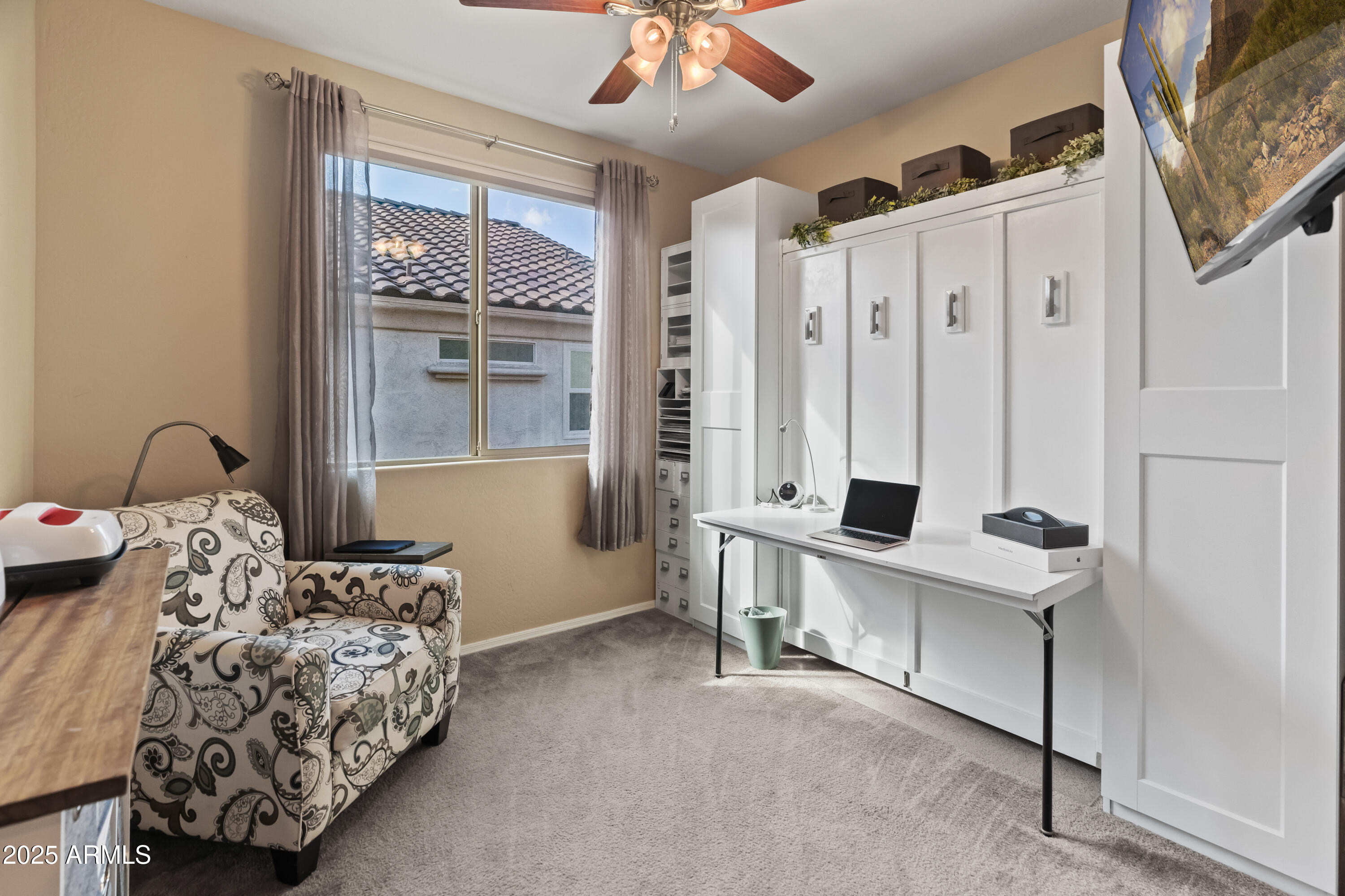 26990 West Utopia Road Buckeye, AZ 85396 - Photo 28 of 41 a bedroom with furniture and a window