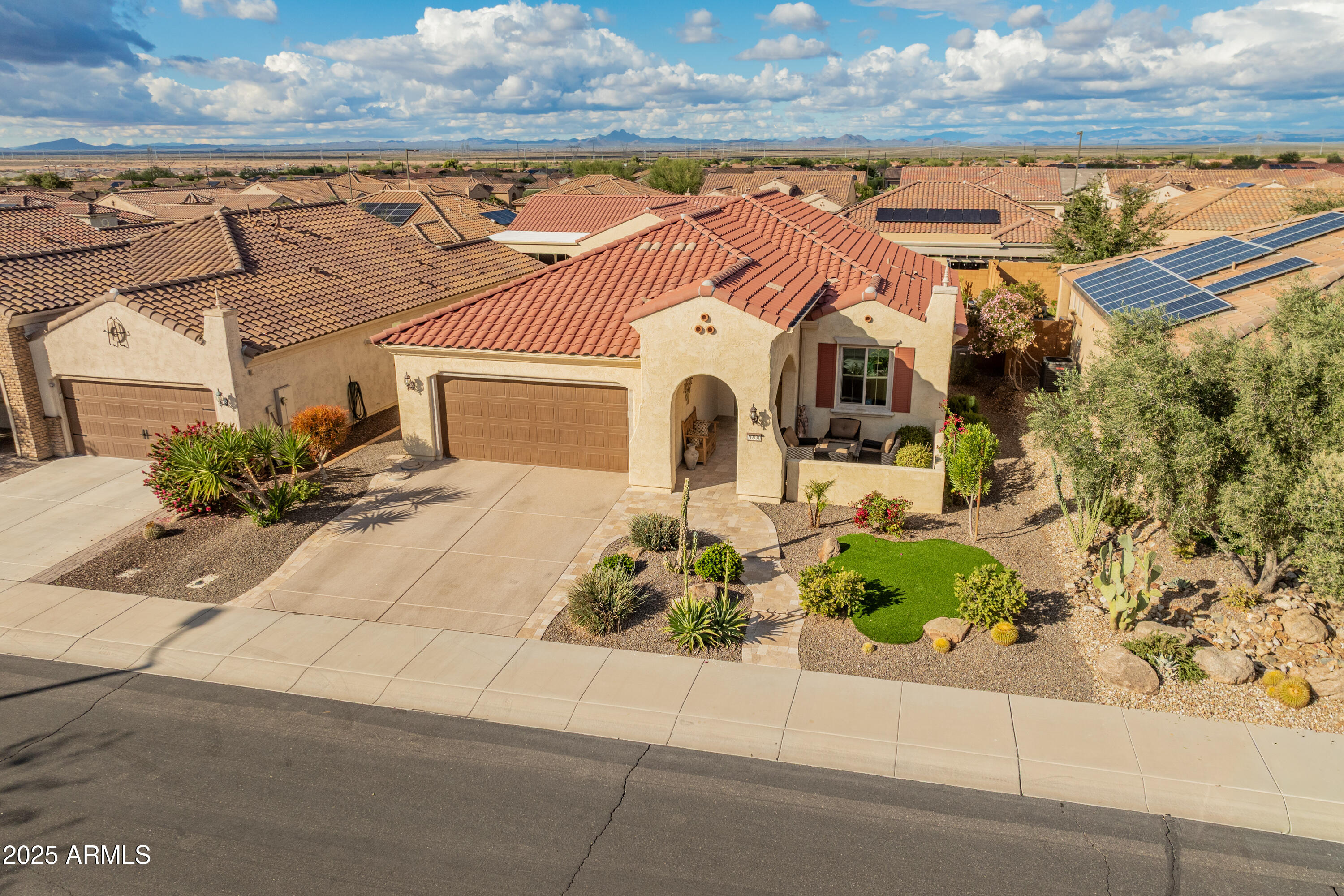 26990 West Utopia Road Buckeye, AZ 85396 - Photo 2 of 41 a front view of a house with a yard