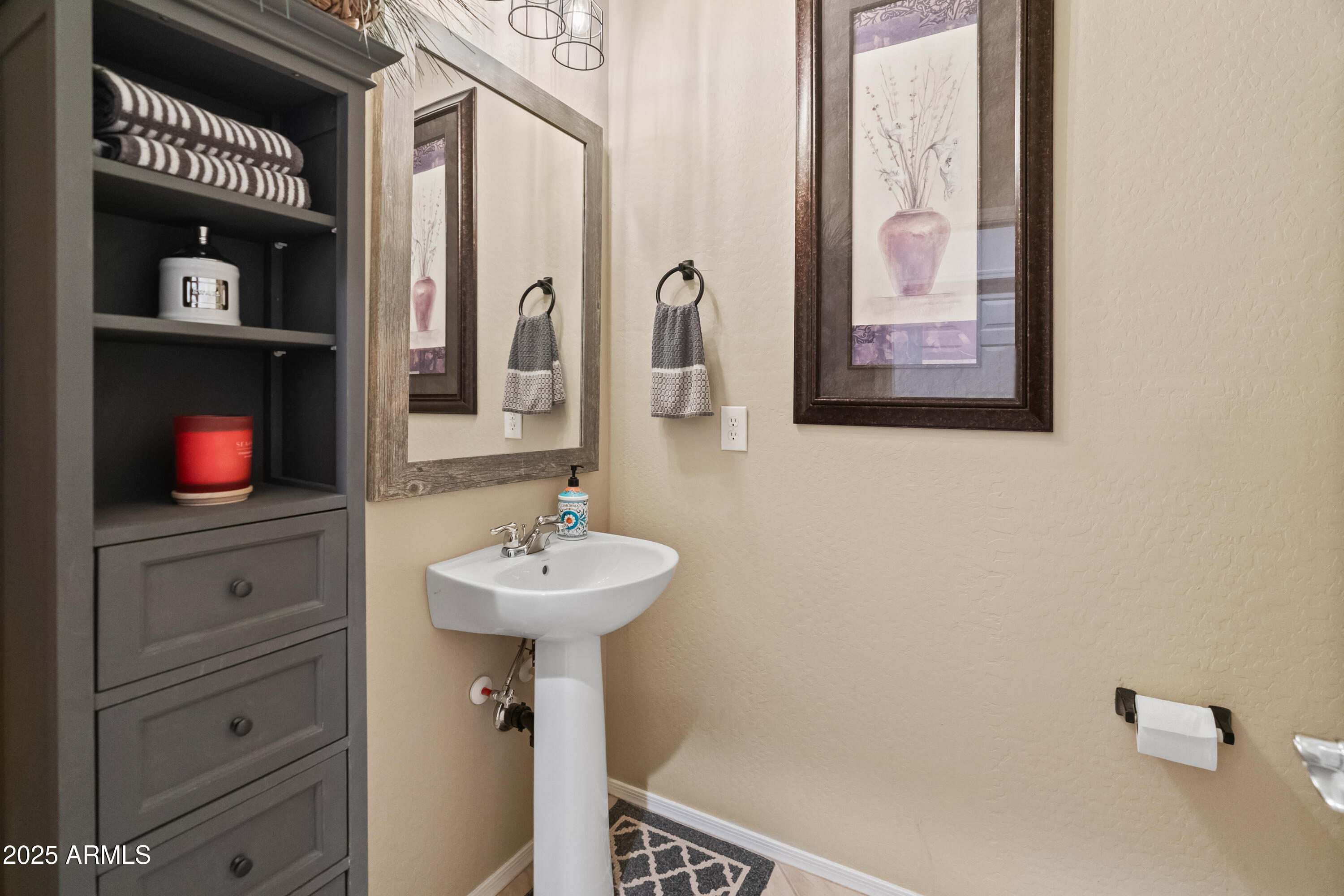 26990 West Utopia Road Buckeye, AZ 85396 - Photo 29 of 41 a bathroom with a sink and a mirror