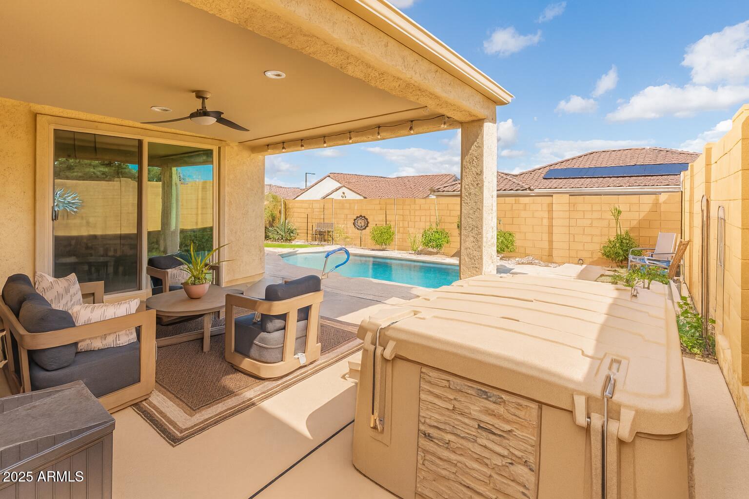 26990 West Utopia Road Buckeye, AZ 85396 - Photo 34 of 41 a room with kitchen island a large window in it