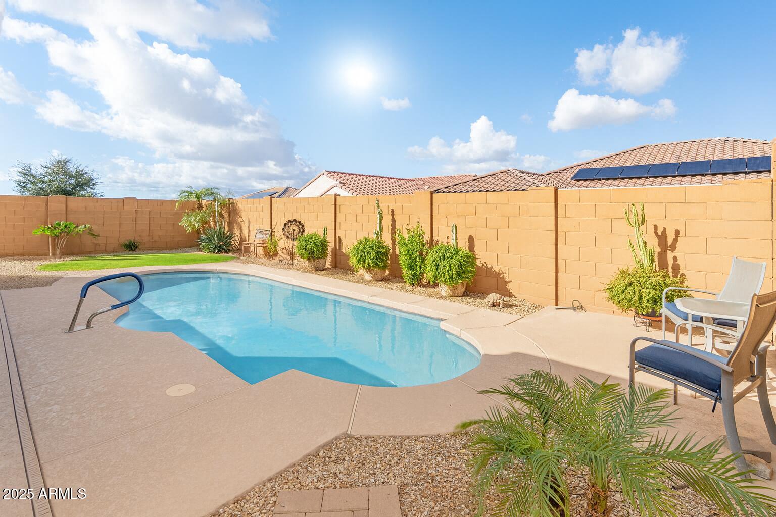 26990 West Utopia Road Buckeye, AZ 85396 - Photo 35 of 41 a view of a swimming pool with a patio