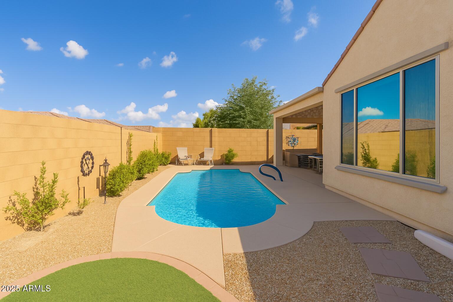 26990 West Utopia Road Buckeye, AZ 85396 - Photo 38 of 41 a swimming pool with outdoor seating and yard