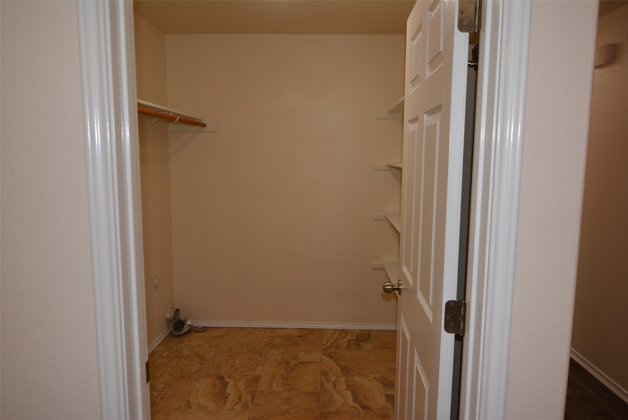 1303 Horseshoe Ranch Drive Leander, TX 78641 - Photo 10 of 26 Ample storage solutions define this practical laundry room, featuring essential hookups and convenient shelving.