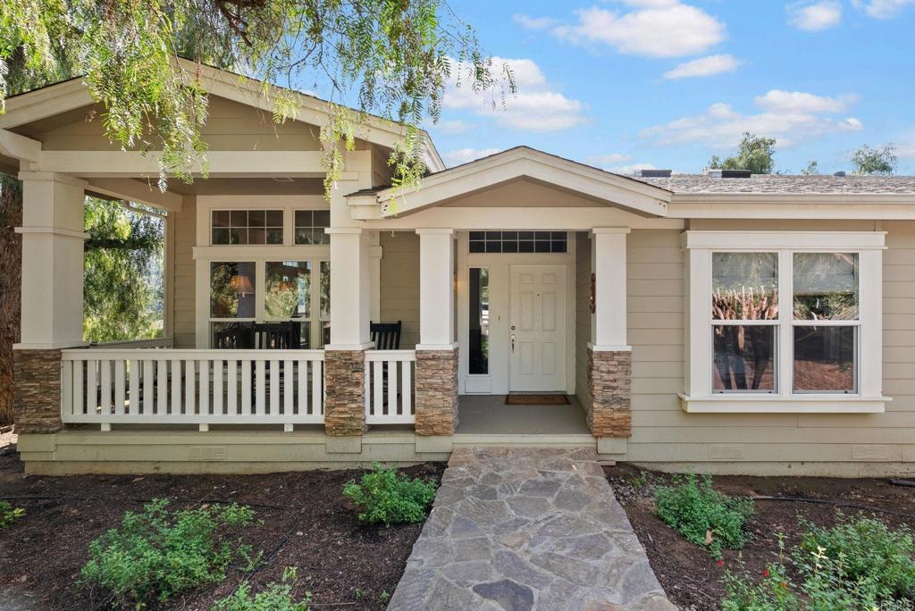 Undisclosed Address Valley Center, CA 92082 - Photo 14 of 60 a front view of a house with garden
