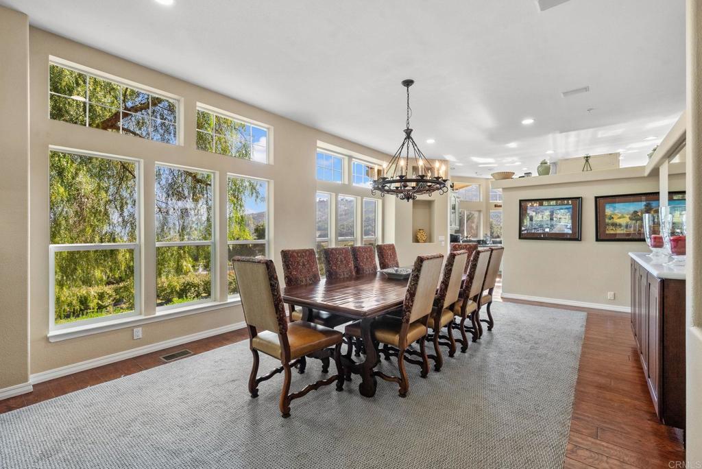 Undisclosed Address Valley Center, CA 92082 - Photo 15 of 60 a view of a dining room with furniture window and wooden floor