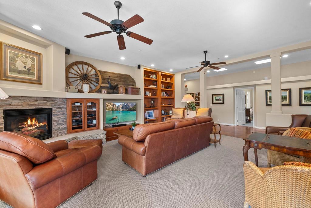 Undisclosed Address Valley Center, CA 92082 - Photo 16 of 60 a living room with furniture ceiling fan and a fireplace