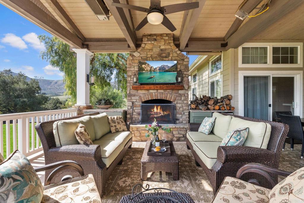 Undisclosed Address Valley Center, CA 92082 - Photo 34 of 60 a outdoor living space with furniture flat screen tv and a fireplace