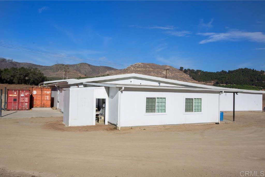 Undisclosed Address Valley Center, CA 92082 - Photo 49 of 60 front view of a house with a yard