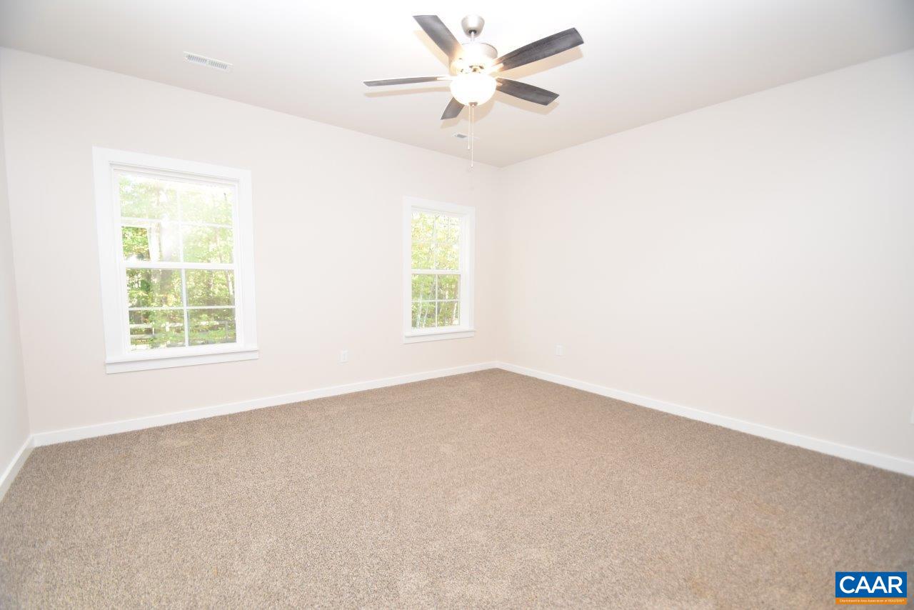 1060 Hanback Road Gordonsville, VA 22942 - Photo 12 of 19 an empty room with a window and a fan