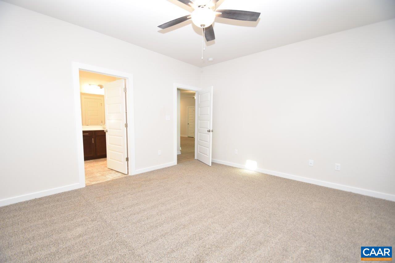 1060 Hanback Road Gordonsville, VA 22942 - Photo 13 of 19 a view of an empty room with a ceiling fan