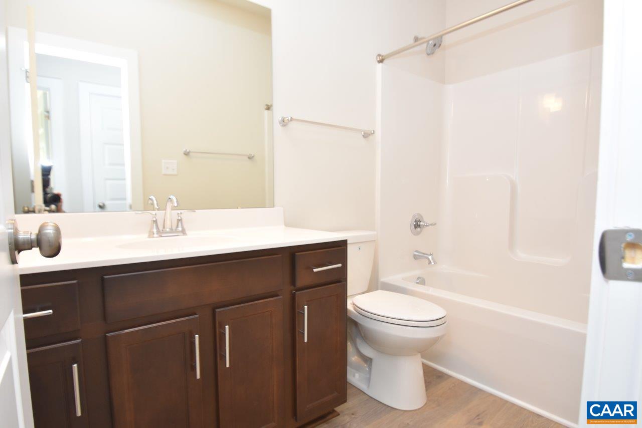 1060 Hanback Road Gordonsville, VA 22942 - Photo 18 of 19 a bathroom with a sink a toilet and a mirror