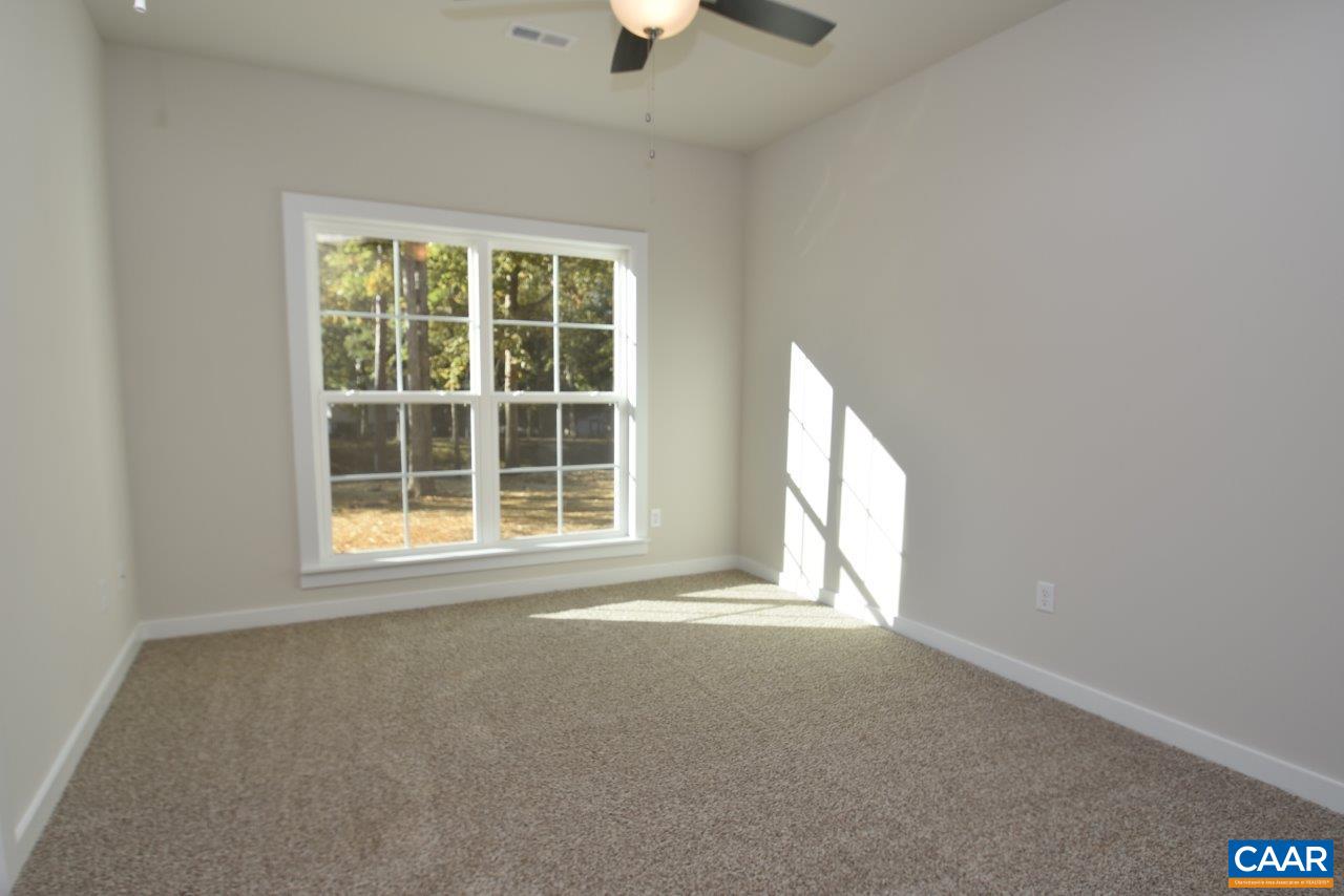 1060 Hanback Road Gordonsville, VA 22942 - Photo 19 of 19 an empty room with a window and a ceiling fan
