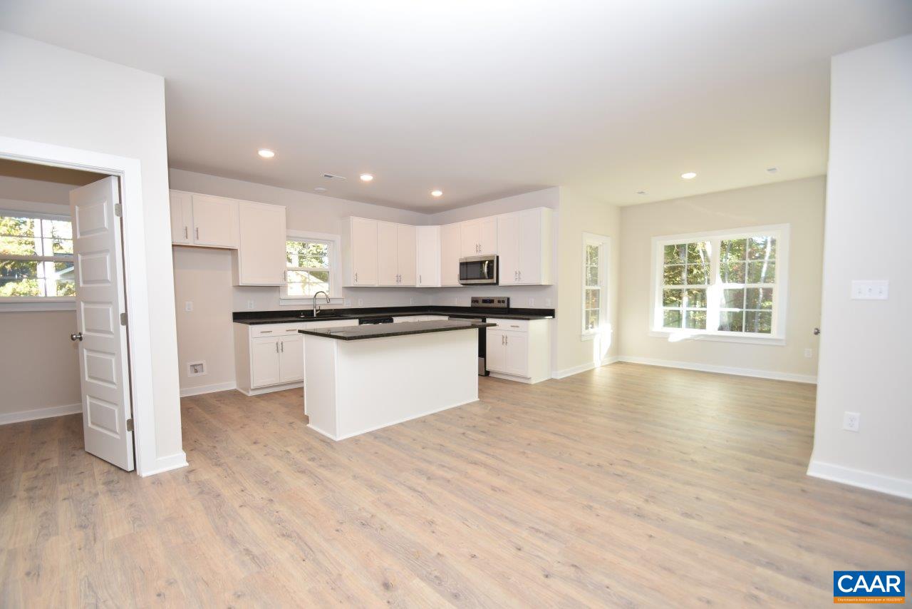 1060 Hanback Road Gordonsville, VA 22942 - Photo 5 of 19 a kitchen with stainless steel appliances granite countertop a refrigerator sink and white cabinets