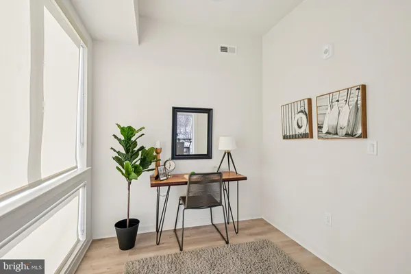 a view of a workspace with furniture