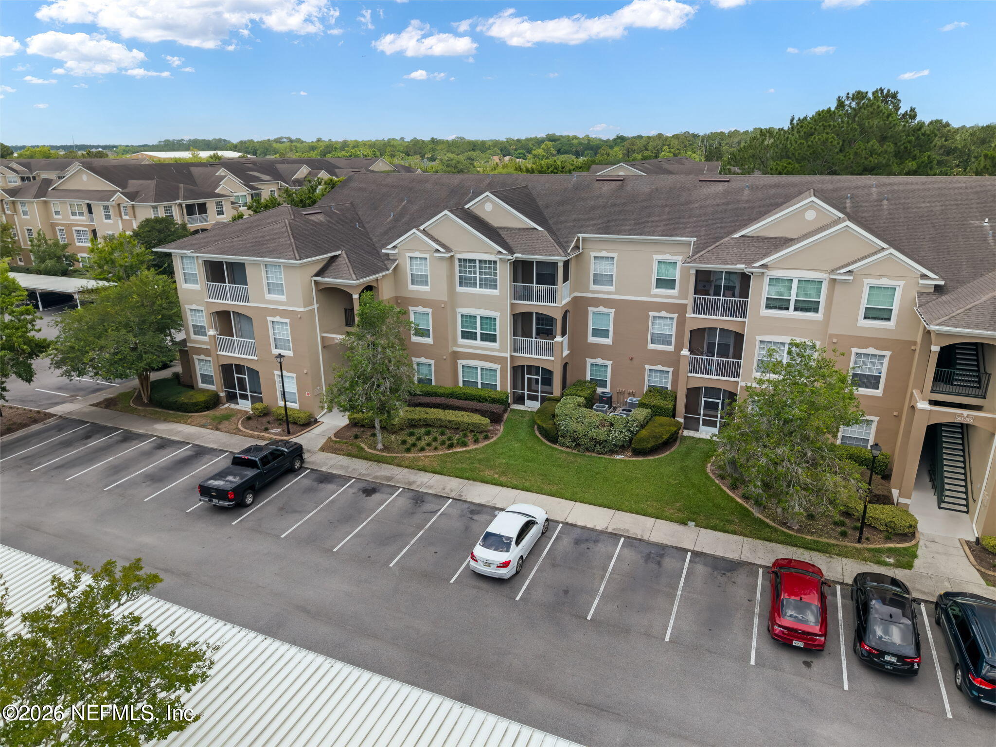 7990 Baymeadows Road East, Unit 520 Jacksonville, FL 32256 - Photo 40 of 41 an aerial view of a house with a garden and patio