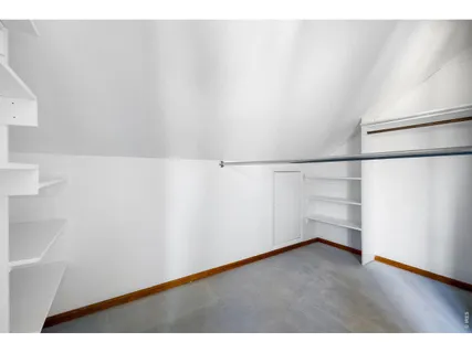 a view of an empty walk in closet