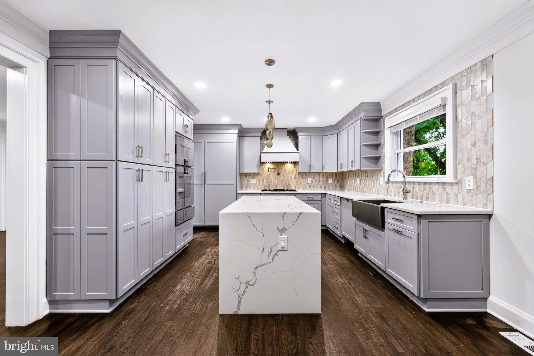 9901 Belhaven Road Bethesda, MD 20817 - Photo 12 of 32 Sleek modern kitchen with elegant finishes.