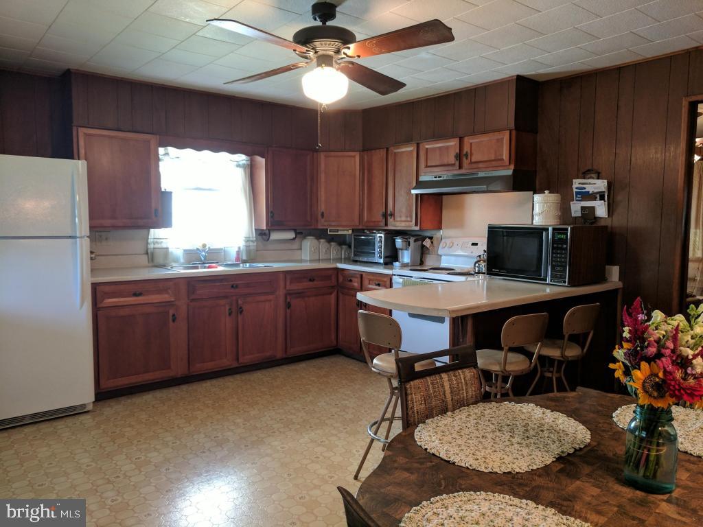 407 Chestnut Street Delta, PA 17314 - Photo 8 of 29 Kitchen offers smooth top cooktop and refrigerator